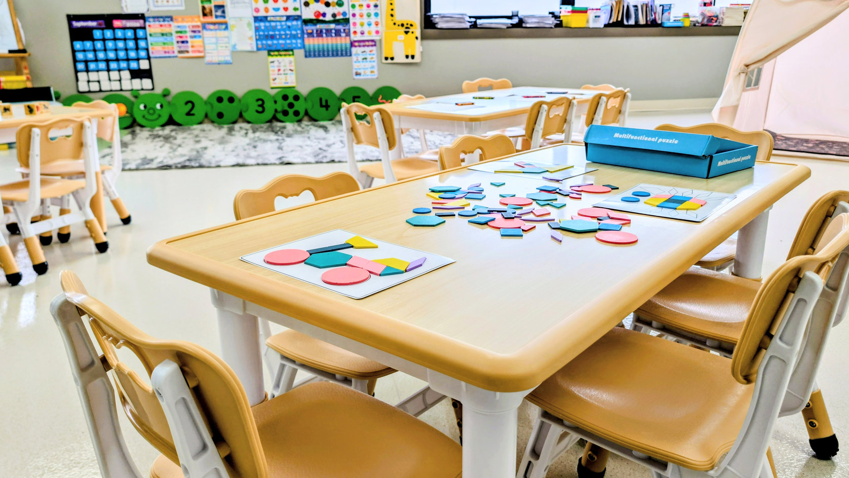 Toddlers building with colourful blocks
